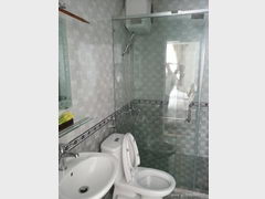 Vietnam, Dalat hotels, Toilet with shower in a cheap hotel